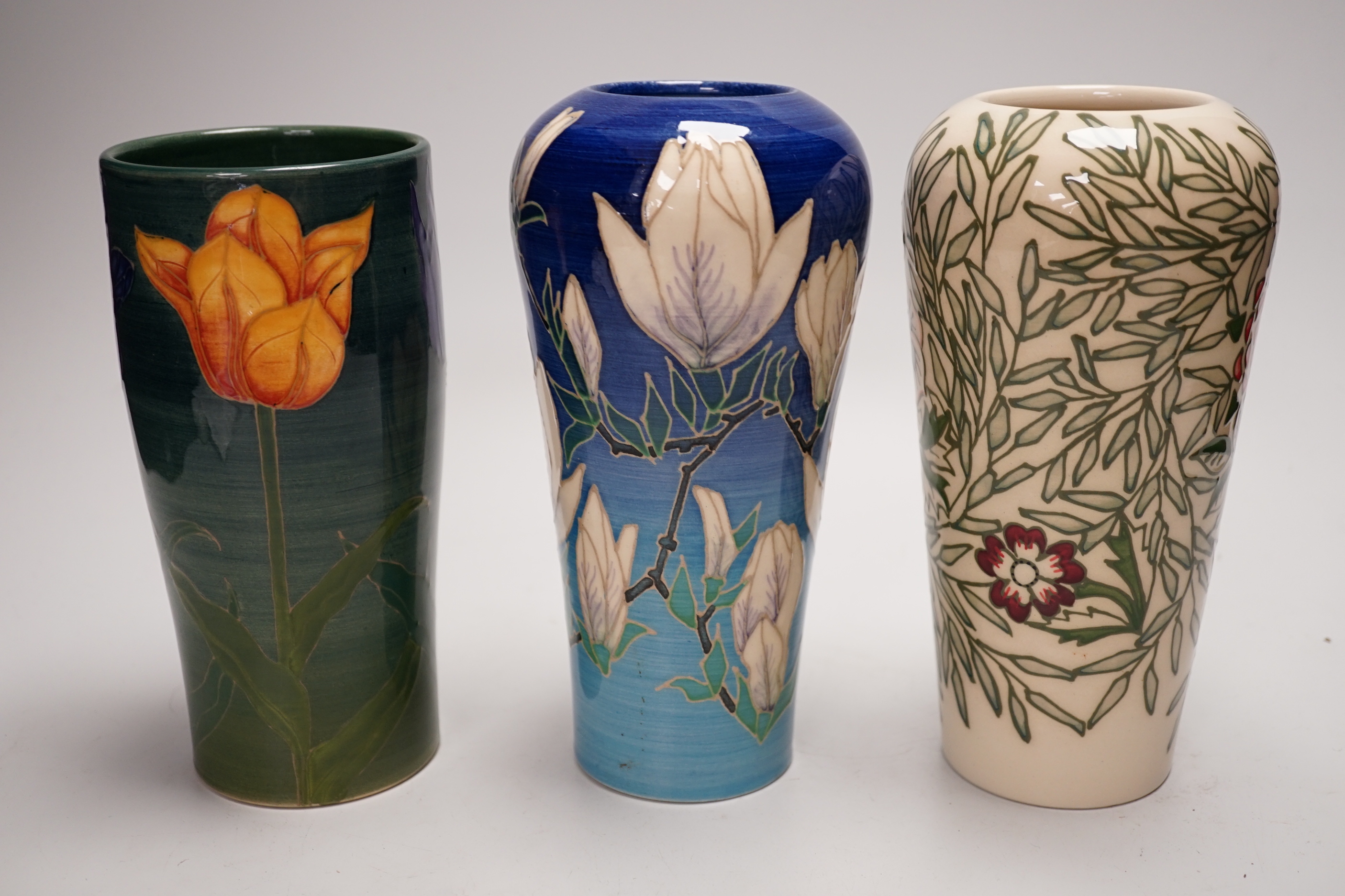 Sally Tuffin for Dennis China Works - three floral design vases, 20cm